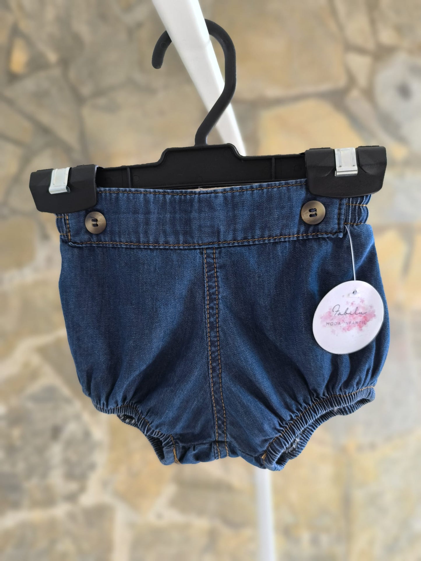 Ranita de bebé en tejido vaquero oscuro unisex con elástico suave y botones decorativos
