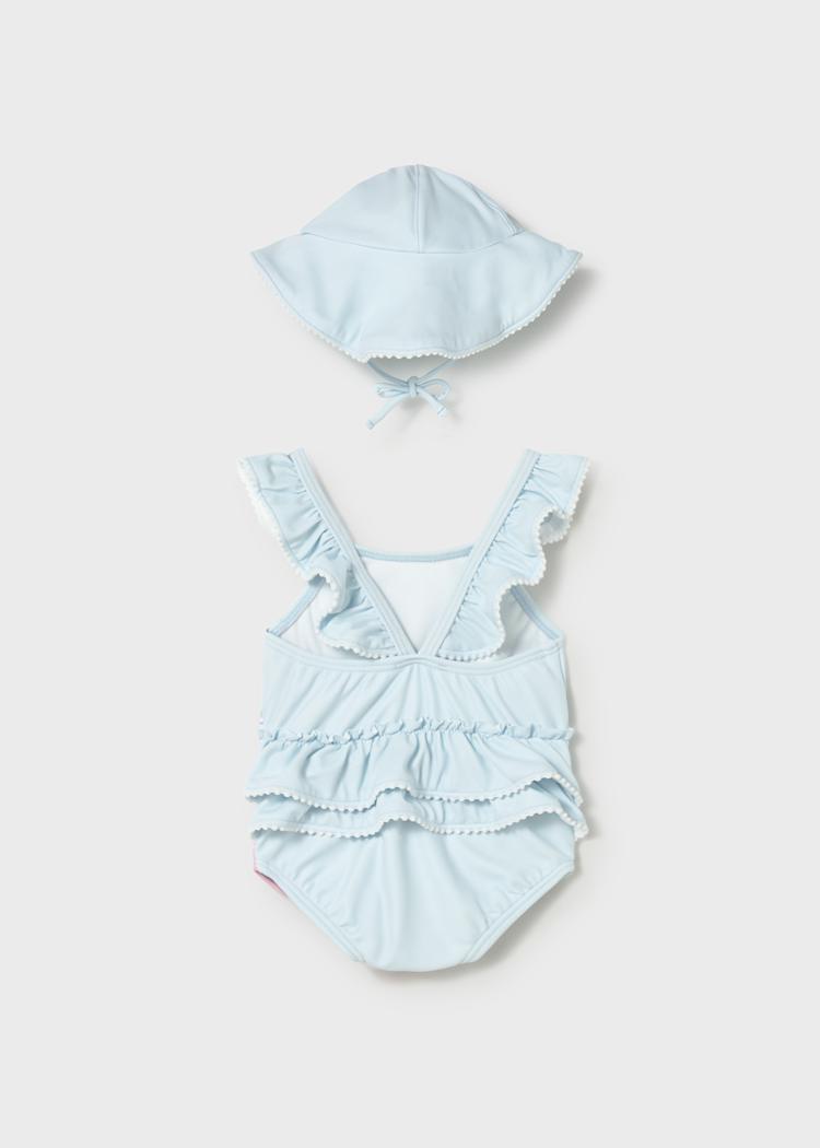 Bañador de bebé con gorro y protección solar UPF | estampado floral en color celeste 🌈☀️