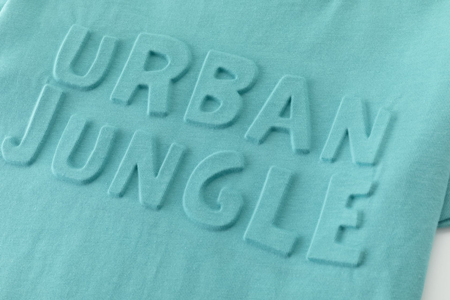 Camiseta de niño azul turquesa “Urban Jungle” | 100% Algodón