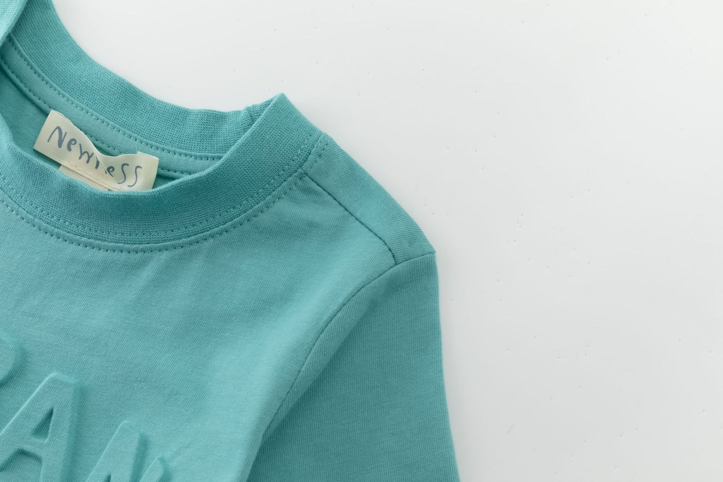 Camiseta de niño azul turquesa “Urban Jungle” | 100% Algodón