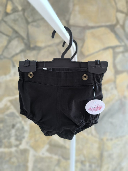 Ranita de bebé en color negro unisex con elástico suave y botones decorativos