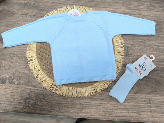 Jersey de lana azul bebé con cadenetas decorativas y botones traseros