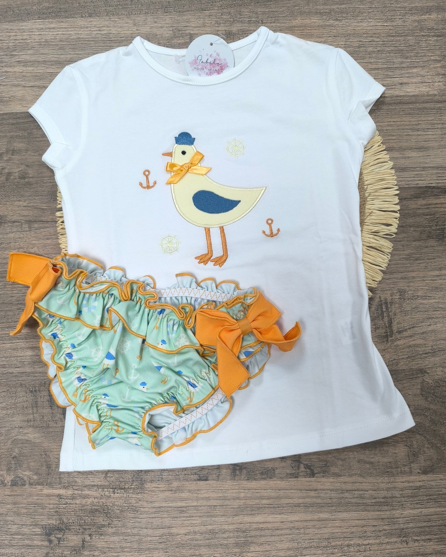 Conjunto de baño para niña con gaviota y culetín verde con lazos