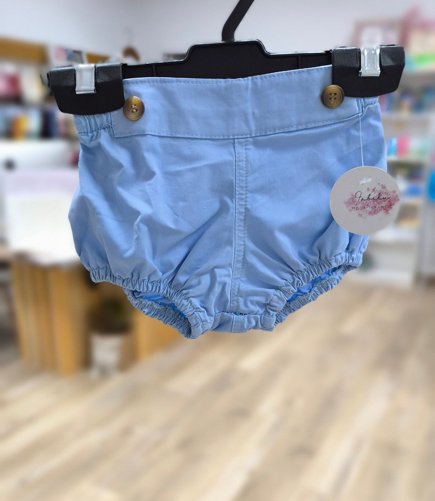 Ranita de bebé celeste unisex con elástico suave y botones decorativos