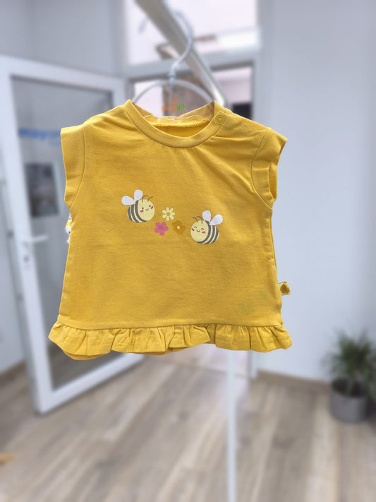 Conjunto primera puesta para bebé Babybol – camiseta amarilla con abejas y flores y cubrepañal floral con volante