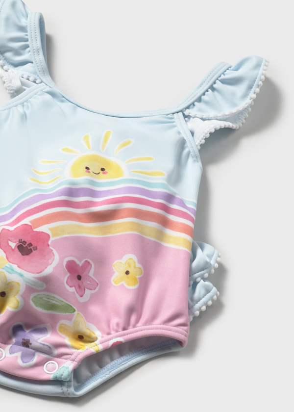 Bañador de bebé con gorro y protección solar UPF | estampado floral en color celeste 🌈☀️